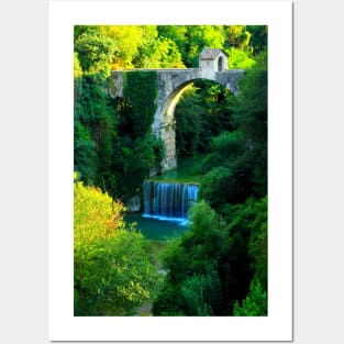 View of Cecco Bridge in Ascoli Piceno with waters of Castellano river flowing below and vegetation Posters and Art